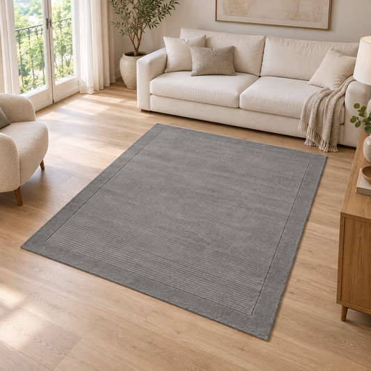 Tapis de Salon Moderne uni Pure Laine CANDY Gris entièrement visible dans un salon lumineux — photo ambiance