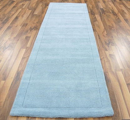 Tapis de couloir uni pure laine CANDY Bleu ciel - Novatrend 